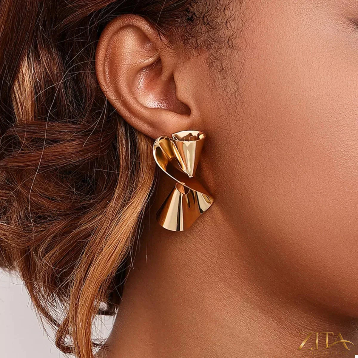 Gold-plated twist earrings by Zita La Belle Elite, featuring a sleek, modern design with a polished finish.