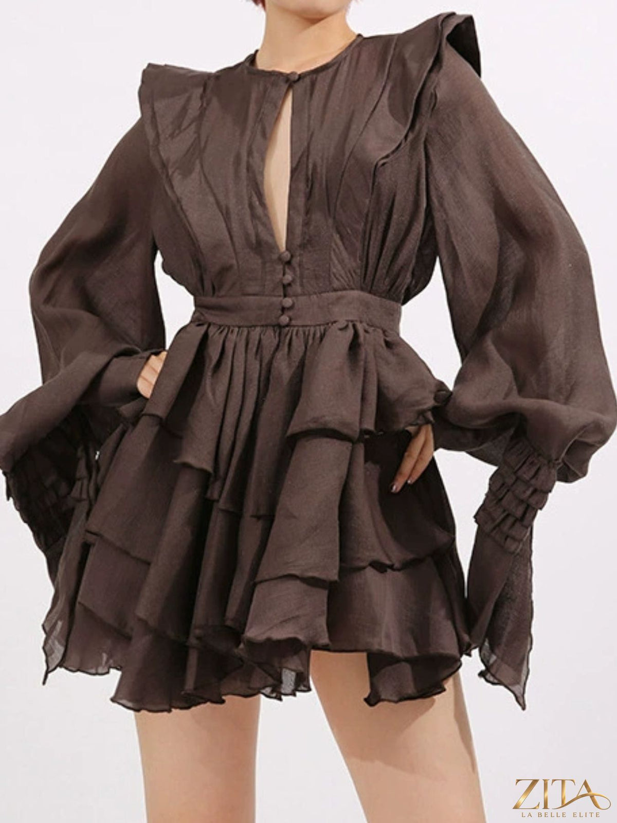 Ruffled long sleeve mini dress from Trendsi featuring a feminine design with ruffle details and a flattering fit.