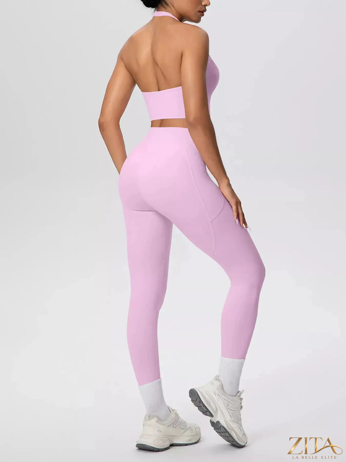 Zita La Belle Elite halter neck crop top and high-waisted leggings active set on a model, showcasing stylish fitness wear.