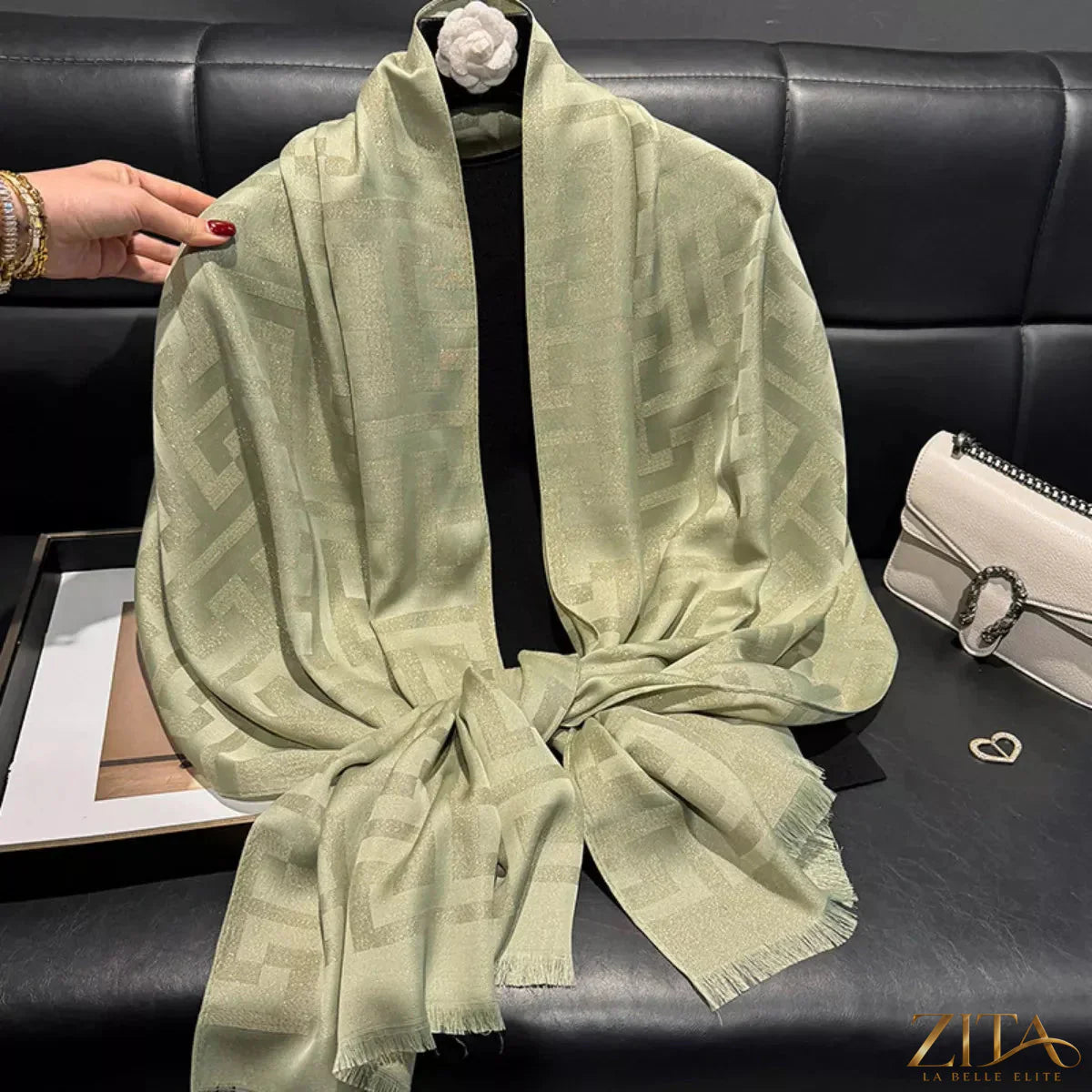 Raw hem scarf by Trendsi featuring soft fabric and a stylish raw edge design, shown draped for a casual, chic look.