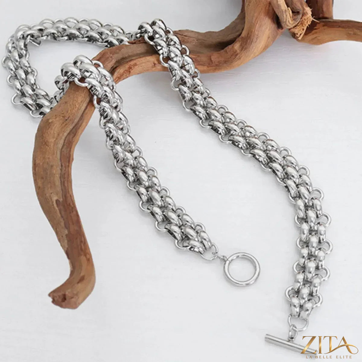 Gold chain link jewelry set featuring a necklace and bracelet with bold, interconnected links in a trendy design.