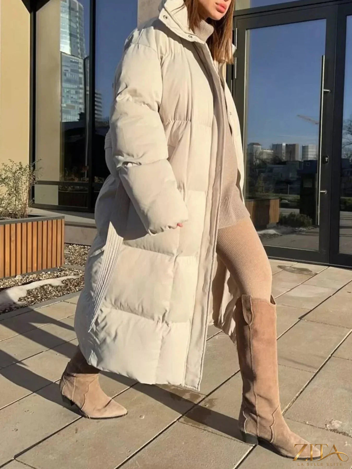 Longline padded winter coat with belt from Zita La Belle Elite, featuring a warm, quilted design and stylish silhouette.
