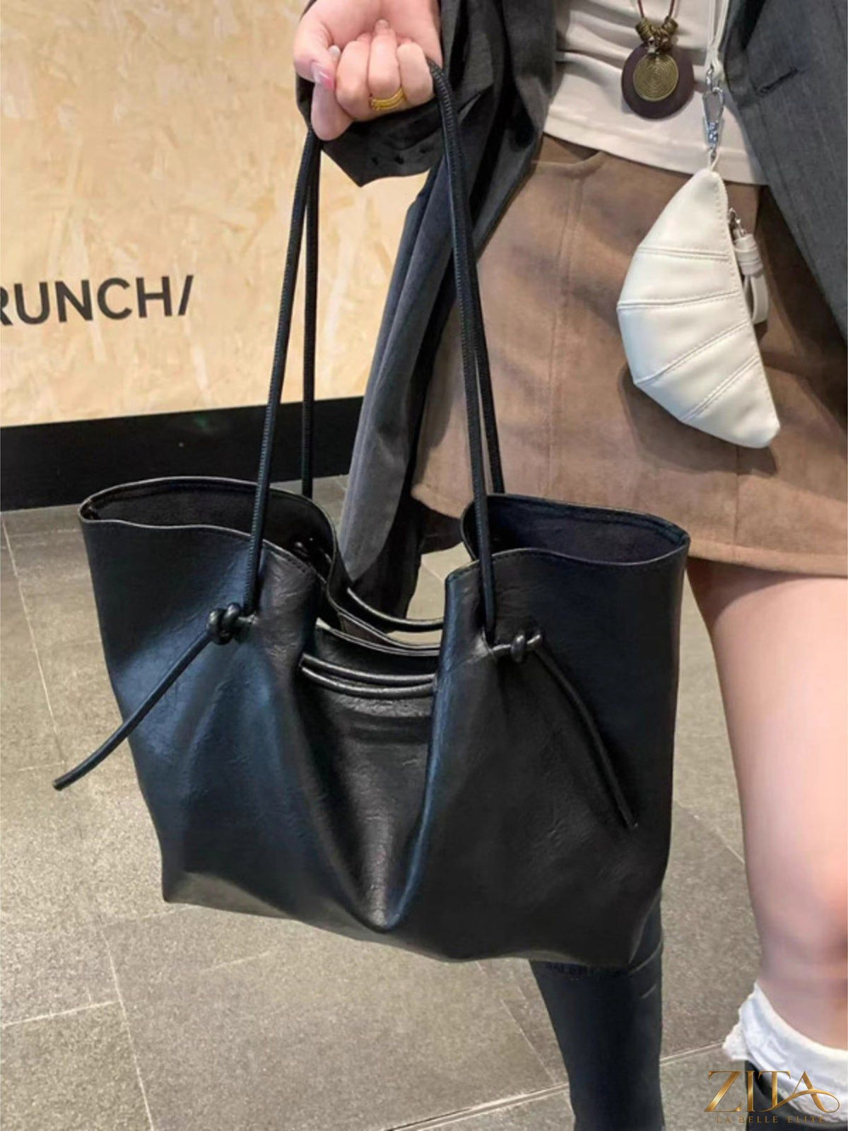 Zita La Belle Elite knot-detail tote bag with structured design and sturdy handles, made from high-quality fabric.