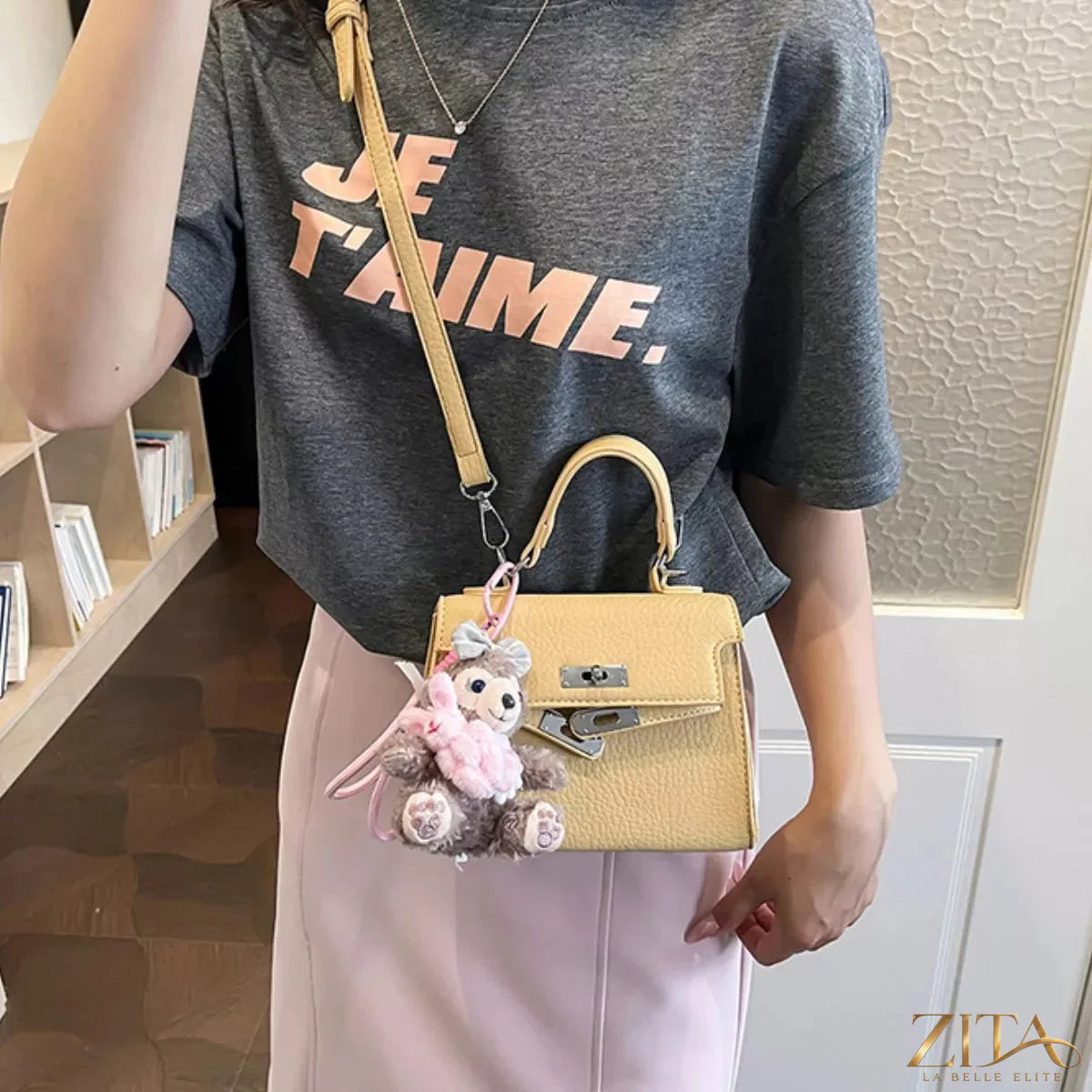 Trendsi PU leather handbag with top handles, gold hardware, and spacious interior, stylish accessory for everyday use.