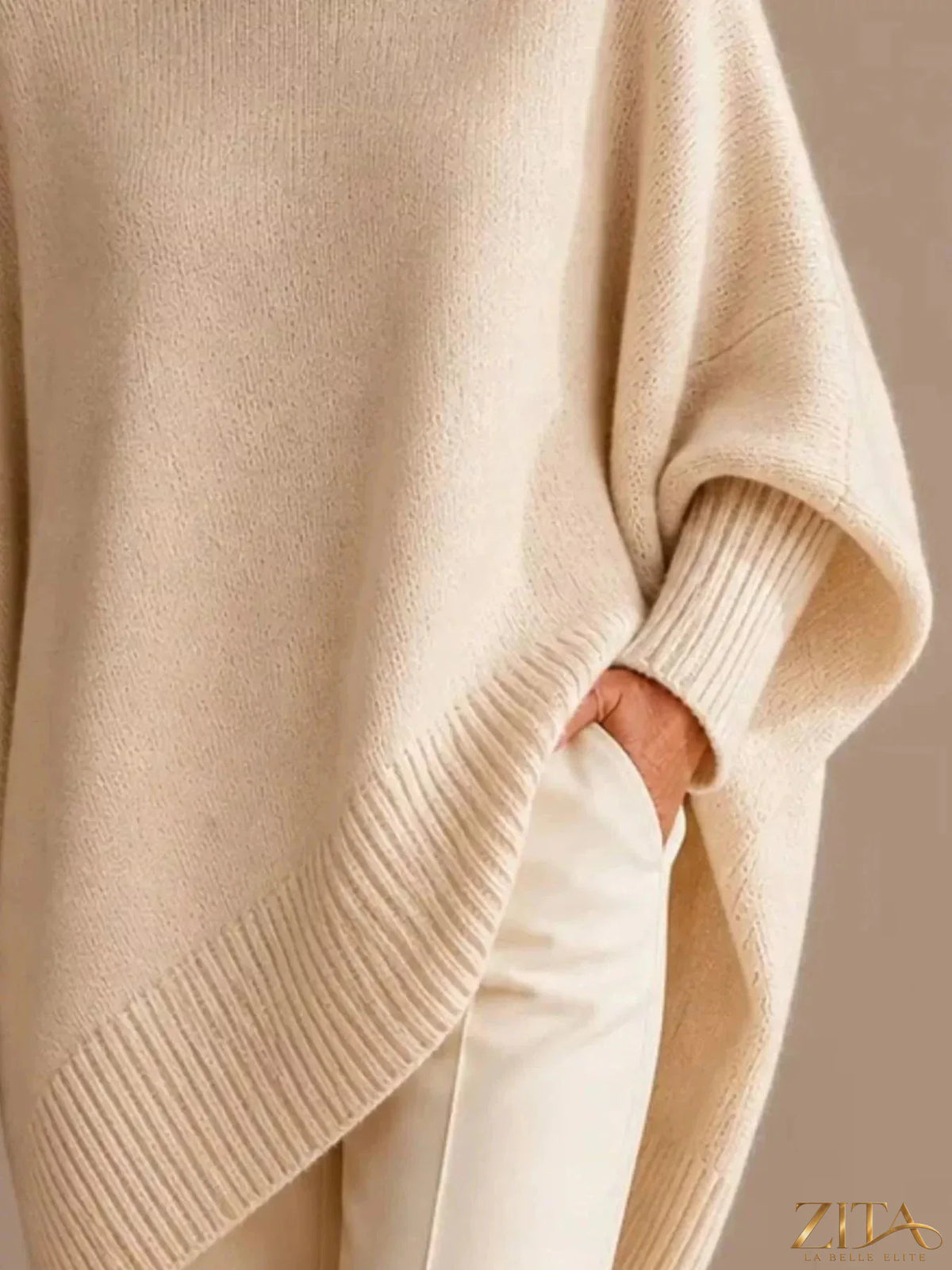 Oversized dropped shoulder sweater by Trendsi, soft knit fabric, relaxed fit, and long sleeves, displayed on a mannequin.