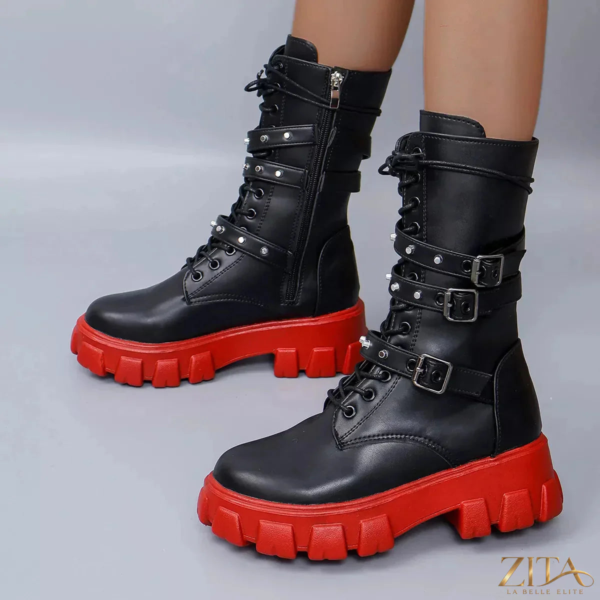 Black buckled lace-up combat boots from Trendsi featuring sturdy soles and metal buckle accents.