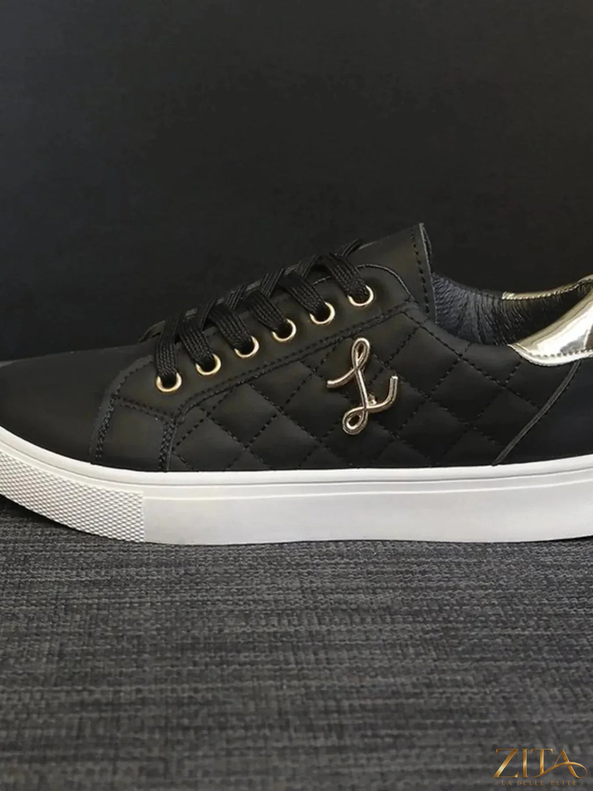 Zita La Belle Elite quilted platform sneakers with metallic gold accents, showcasing stylish sneakers with textured quilting and shiny gold details.