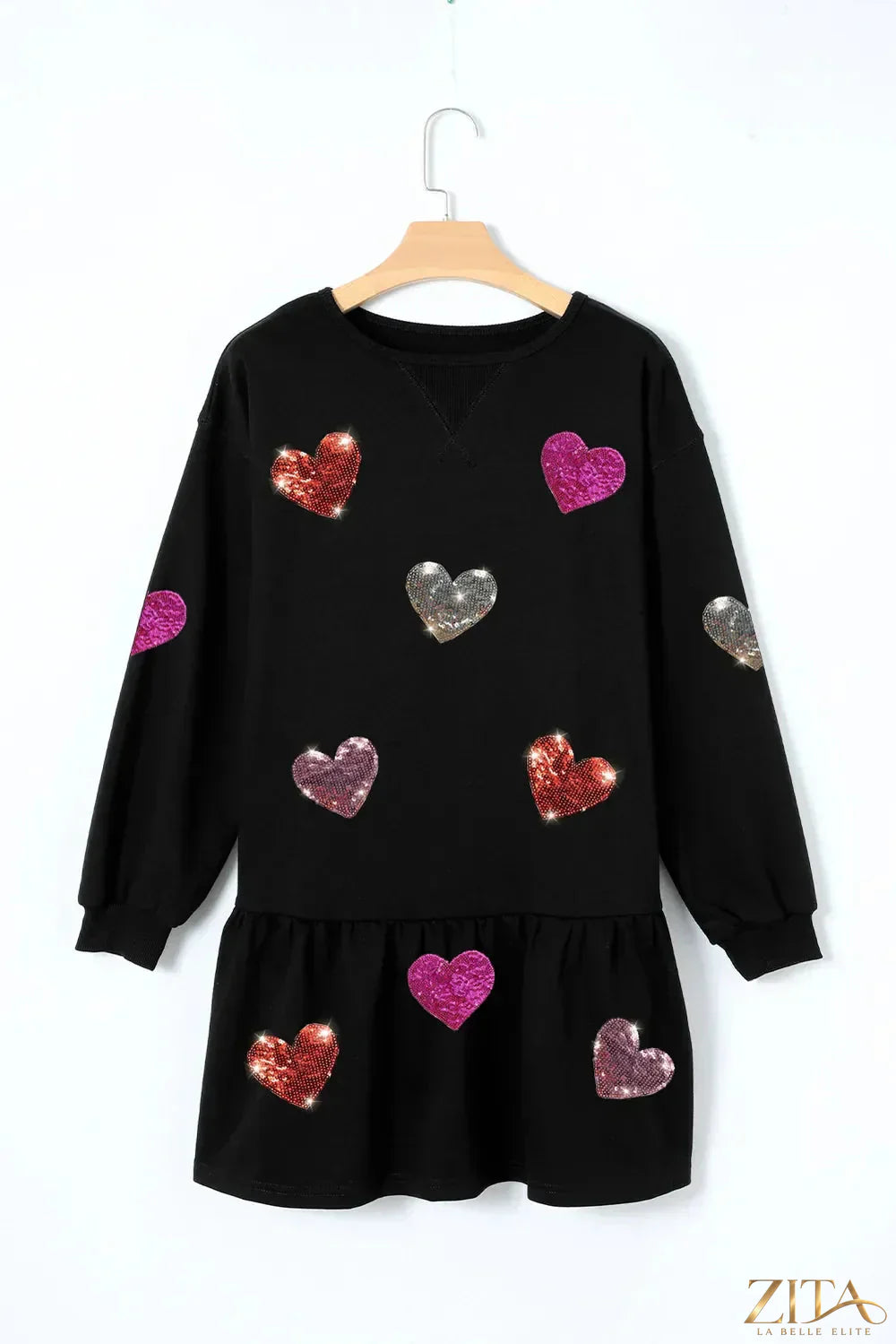 Zita La Belle Elite sequin heart round neck long sleeve mini dress, shiny fabric with a heart detail on the chest and fitted silhouette.