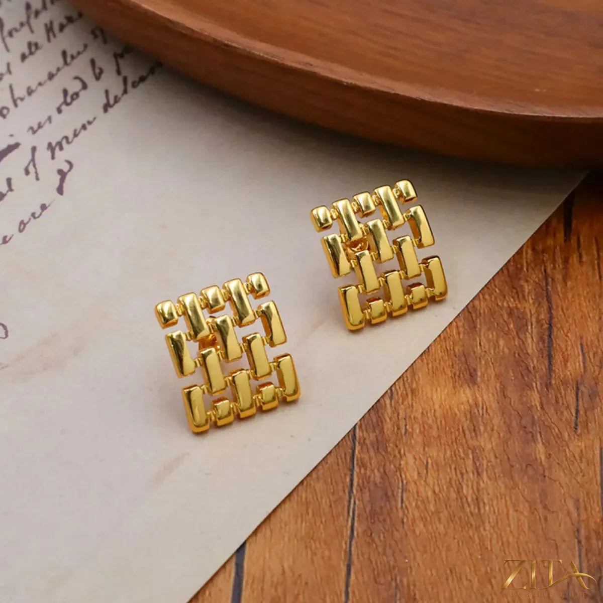 Zita La Belle Elite 18K gold-plated geometric stud earrings with modern angular designs on a white background.