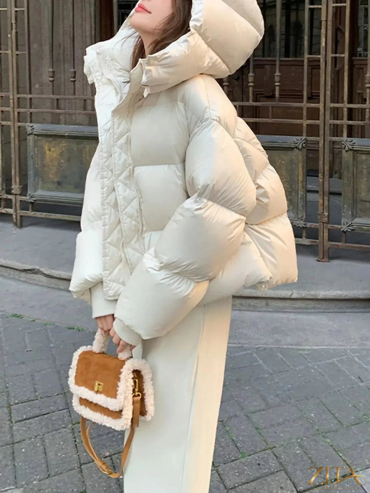 Zita La Belle Elite quilted hooded puffer jacket with insulated design, featuring a high collar and stylish quilted pattern.