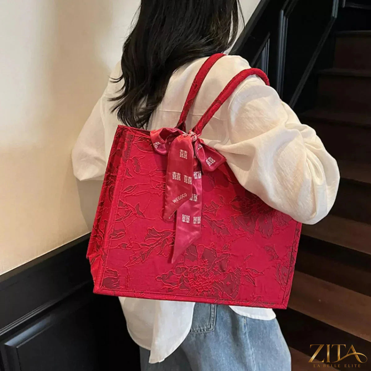 Floral embossed tote handbag by Zita La Belle Elite with a matching scarf accent, featuring textured floral design and spacious interior.