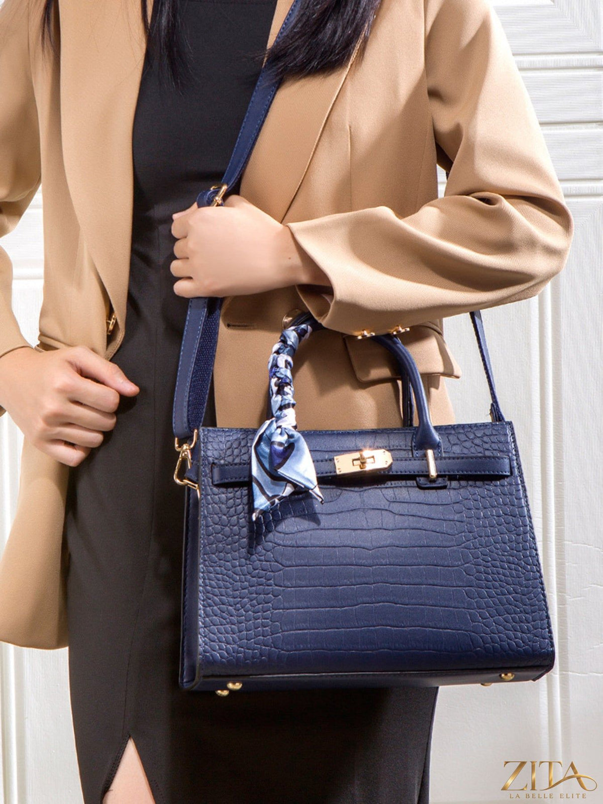 Crocodile embossed leather top handle handbag by Zita La Belle Elite with gold-tone hardware and structured design.