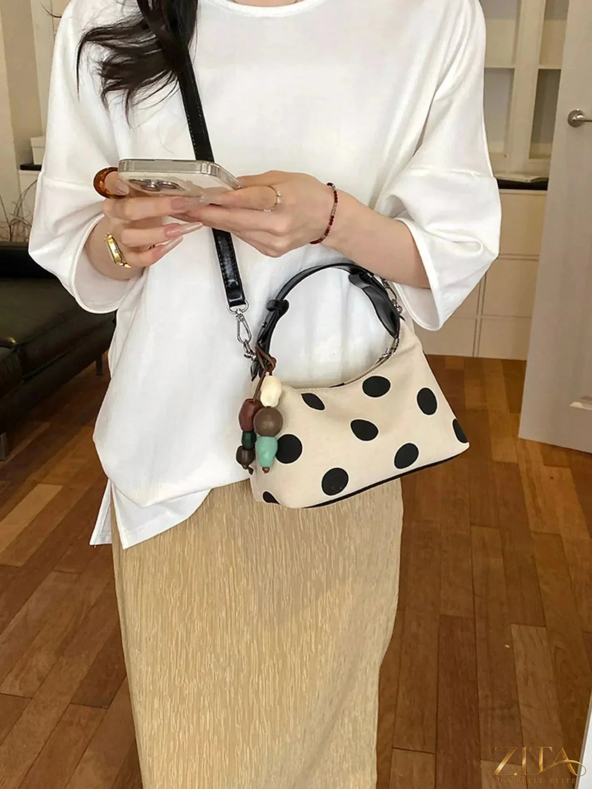 Polka dot PU leather handbag by Zita La Belle Elite with stylish design and top handle, featuring a classic polka dot pattern.