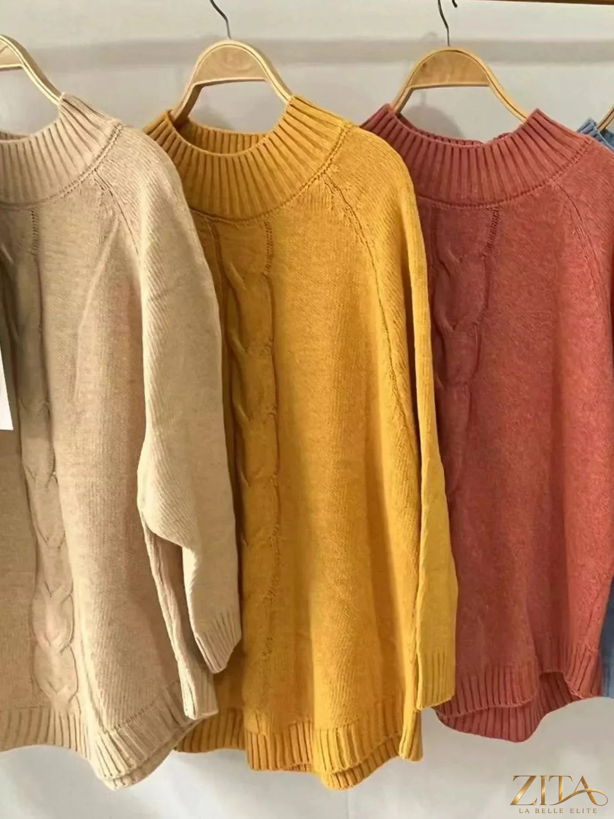 Zita La Belle Elite cable-knit long sleeve sweater in cozy knit fabric, featuring a classic textured pattern and ribbed cuffs.
