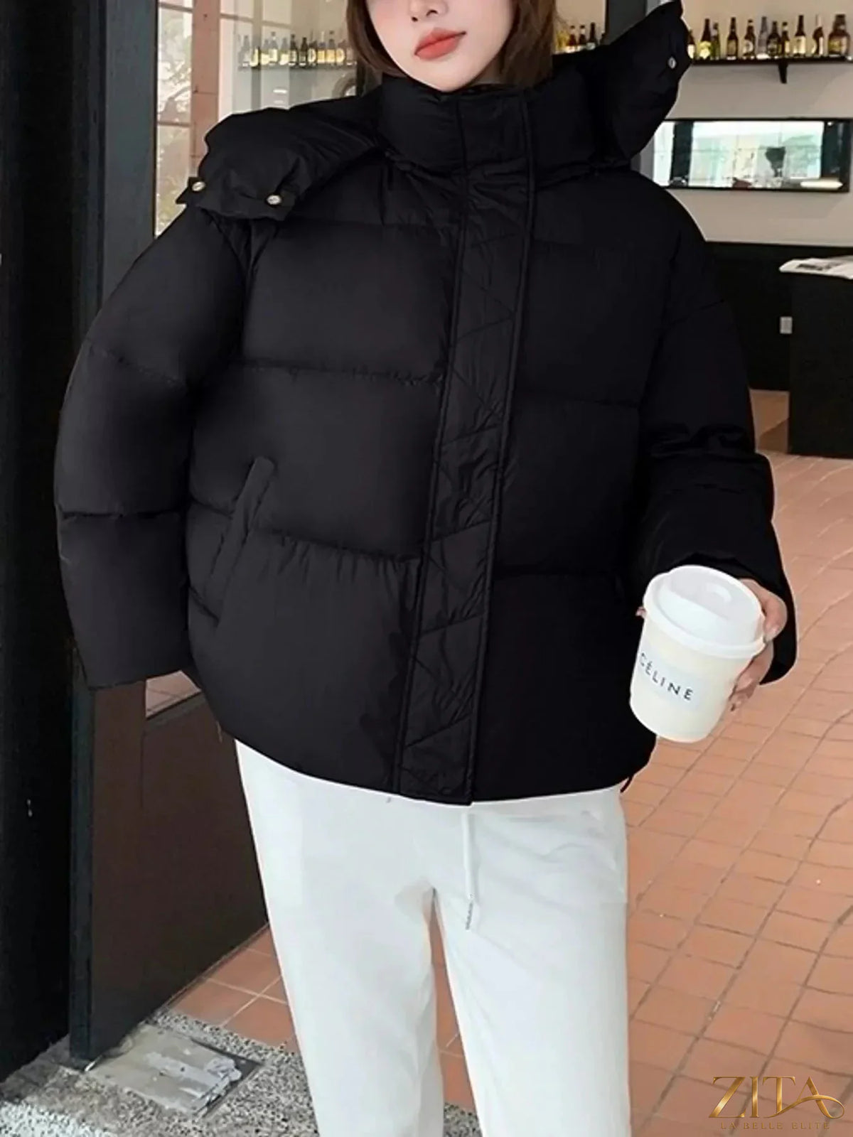 Zita La Belle Elite quilted hooded puffer jacket in black, featuring a padded design and cozy hood for winter warmth.