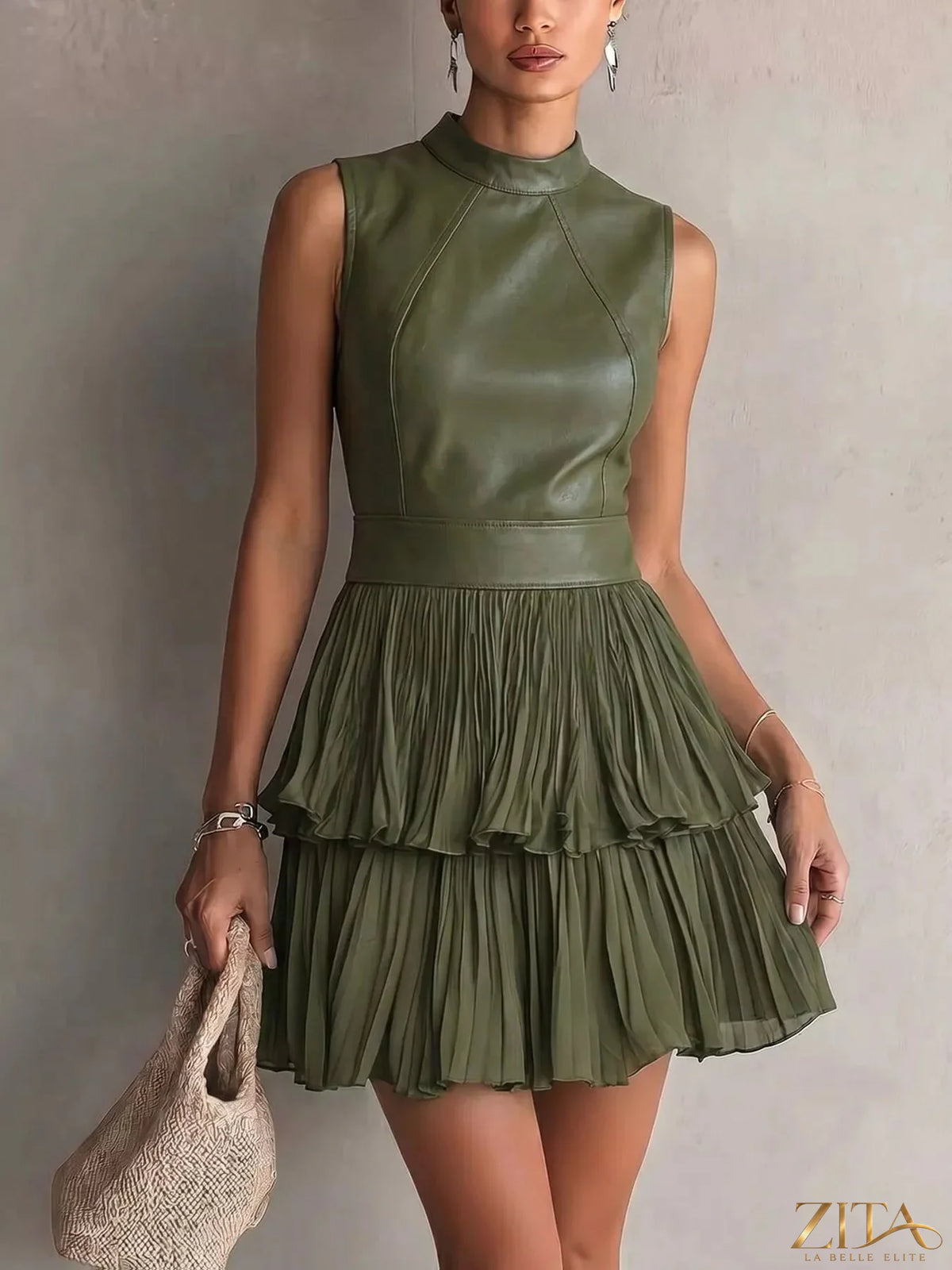 Zita La Belle Elite sleeveless faux leather layered pleated mini dress, showing a close-up of the stylish design and textured fabric.