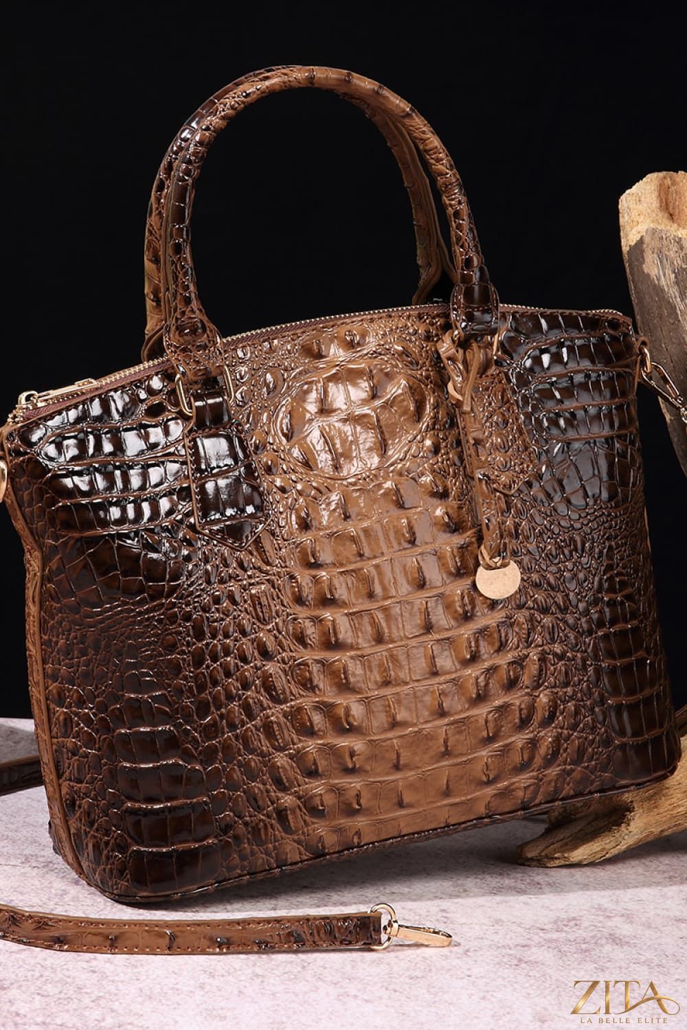 Zita La Belle Elite PU leather handbag with sleek design and top handle, showcasing its elegant black exterior and gold accents.