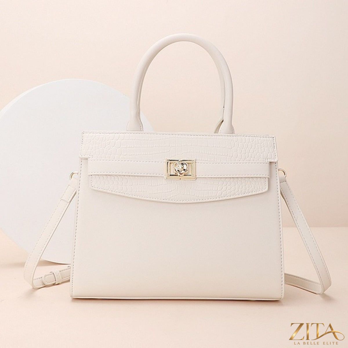 Zita La Belle Elite top handle leather handbag with structured design, featuring a smooth finish and gold-tone hardware.