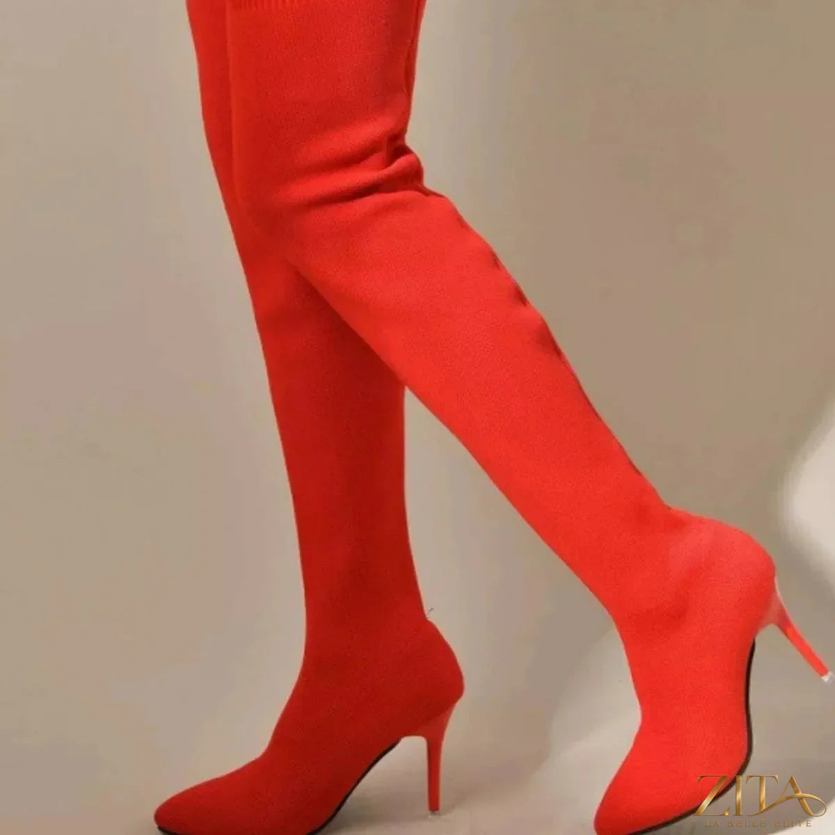 Point toe stiletto boots by Trendsi featuring sleek black leather and high heel, stylish footwear with a modern silhouette.