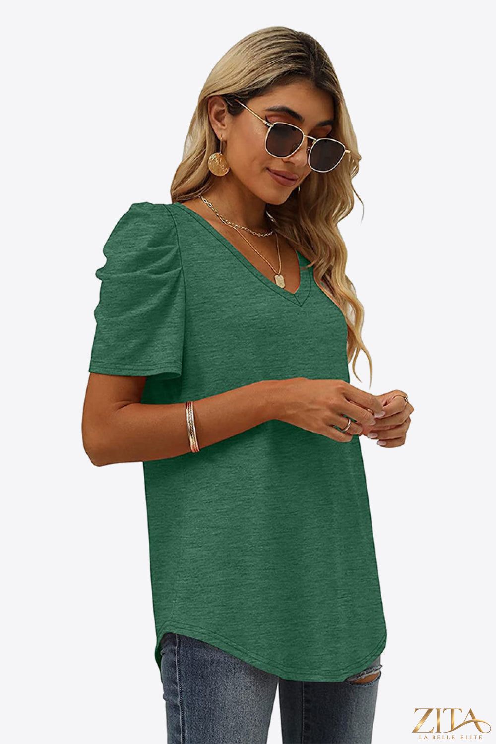 V-neck puff sleeve T-shirt by Trendsi featuring a fitted silhouette and soft fabric in a stylish casual design.