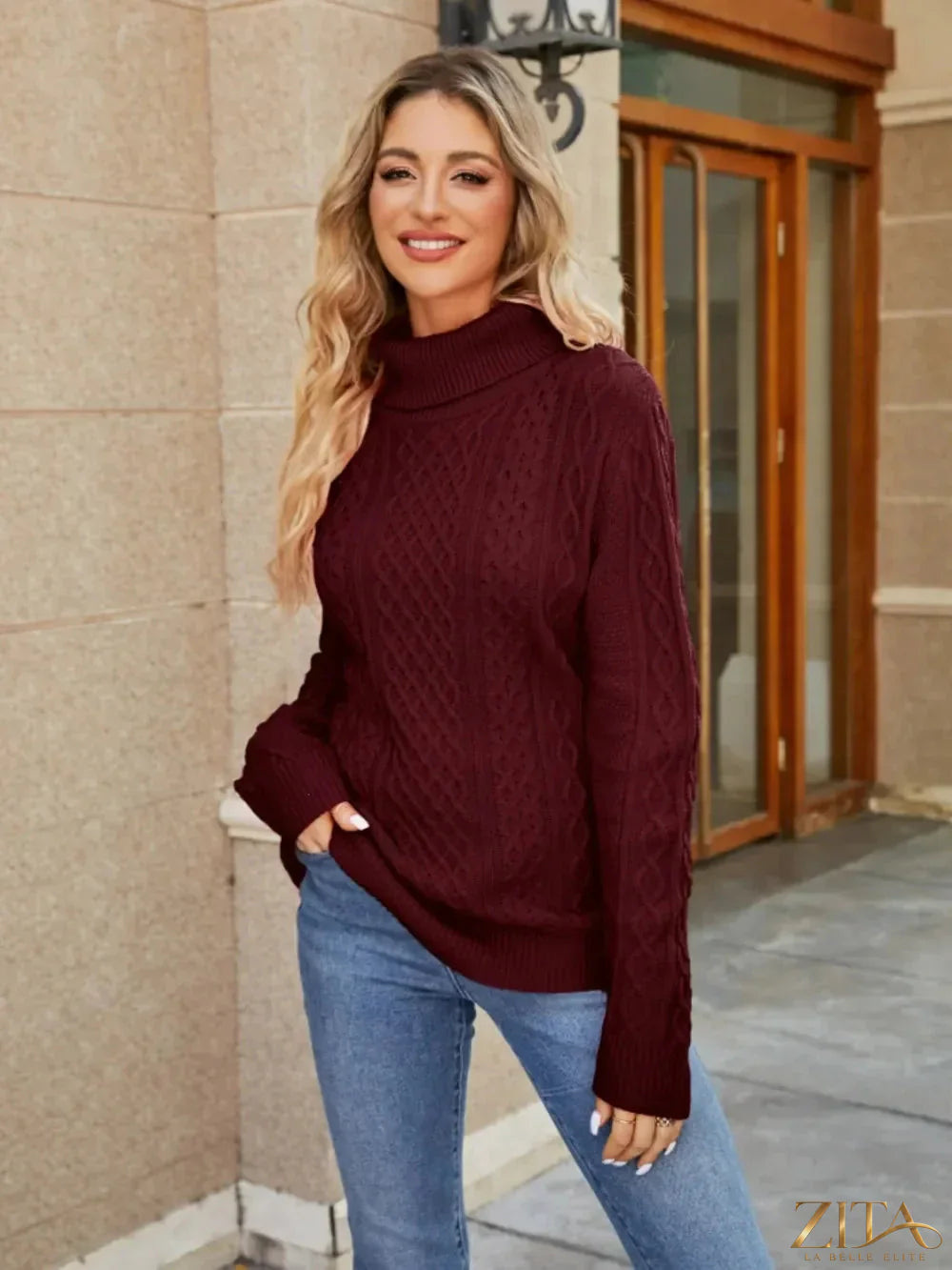 Zita La Belle Elite cable-knit mock neck sweater in cozy, textured knit with a high neckline and long sleeves.