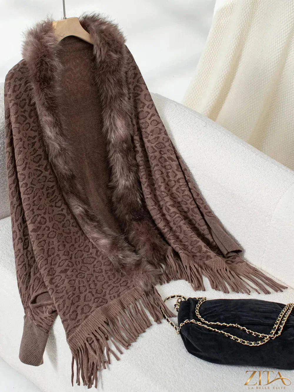 Leopard print fringe open front long sleeve poncho by Trendsi, featuring a stylish animal print and flowing design.