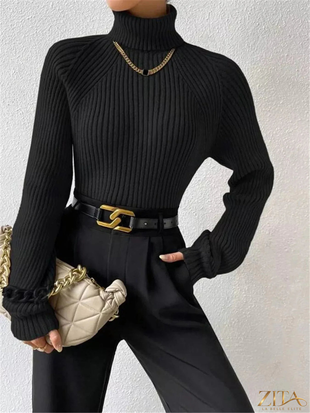 Zita La Belle Elite ribbed knit turtleneck sweater in neutral color, close-up of textured fabric and high neckline.