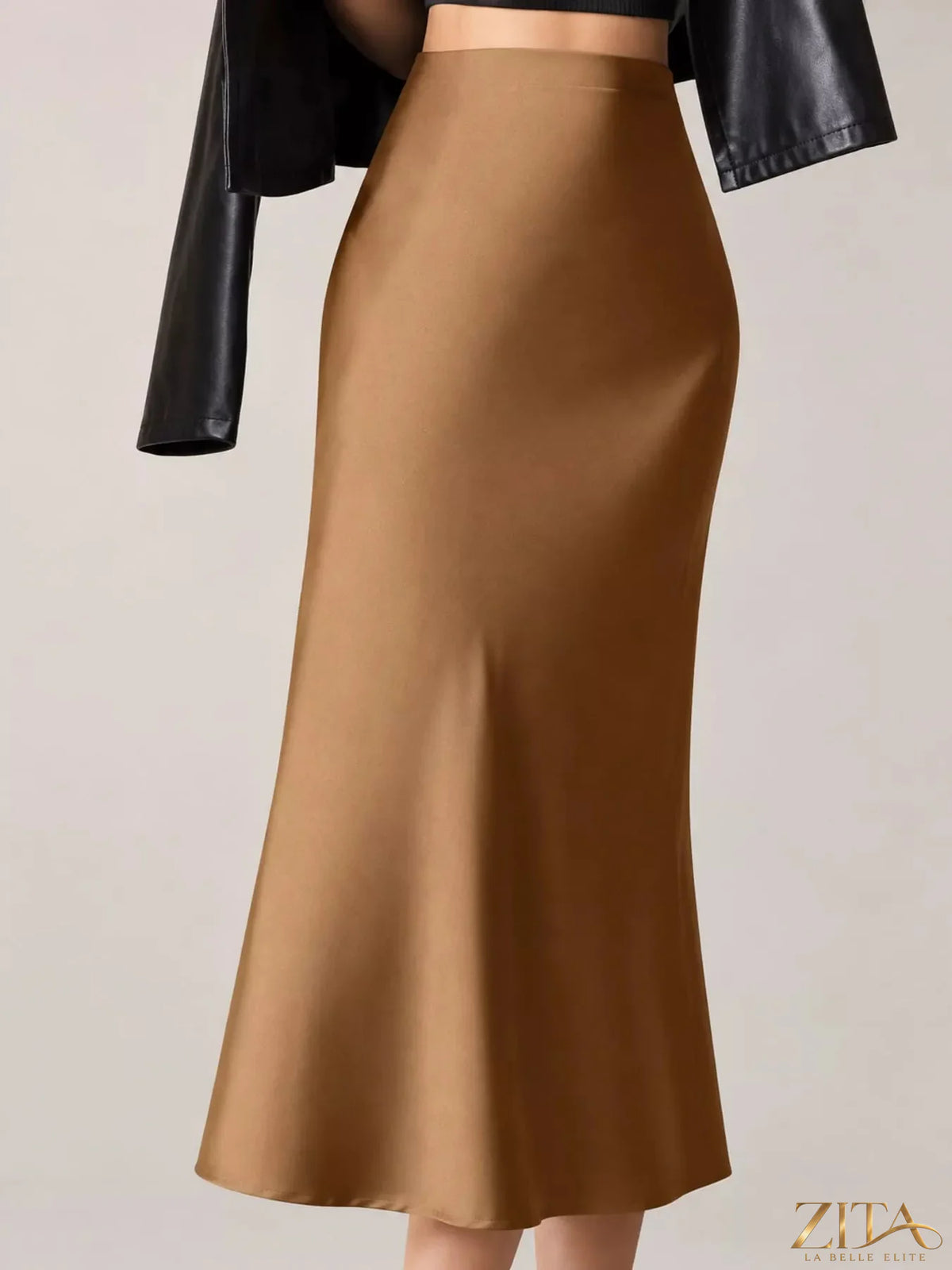 High-waisted satin midi skirt by Trendsi, featuring a smooth, shiny fabric and elegant midi length, perfect for stylish outfits.