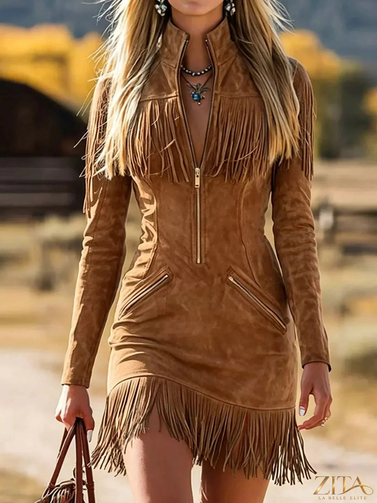 Black fringed zip-front mini dress by Trendsi featuring a stylish fringed hem and a front zipper detail.