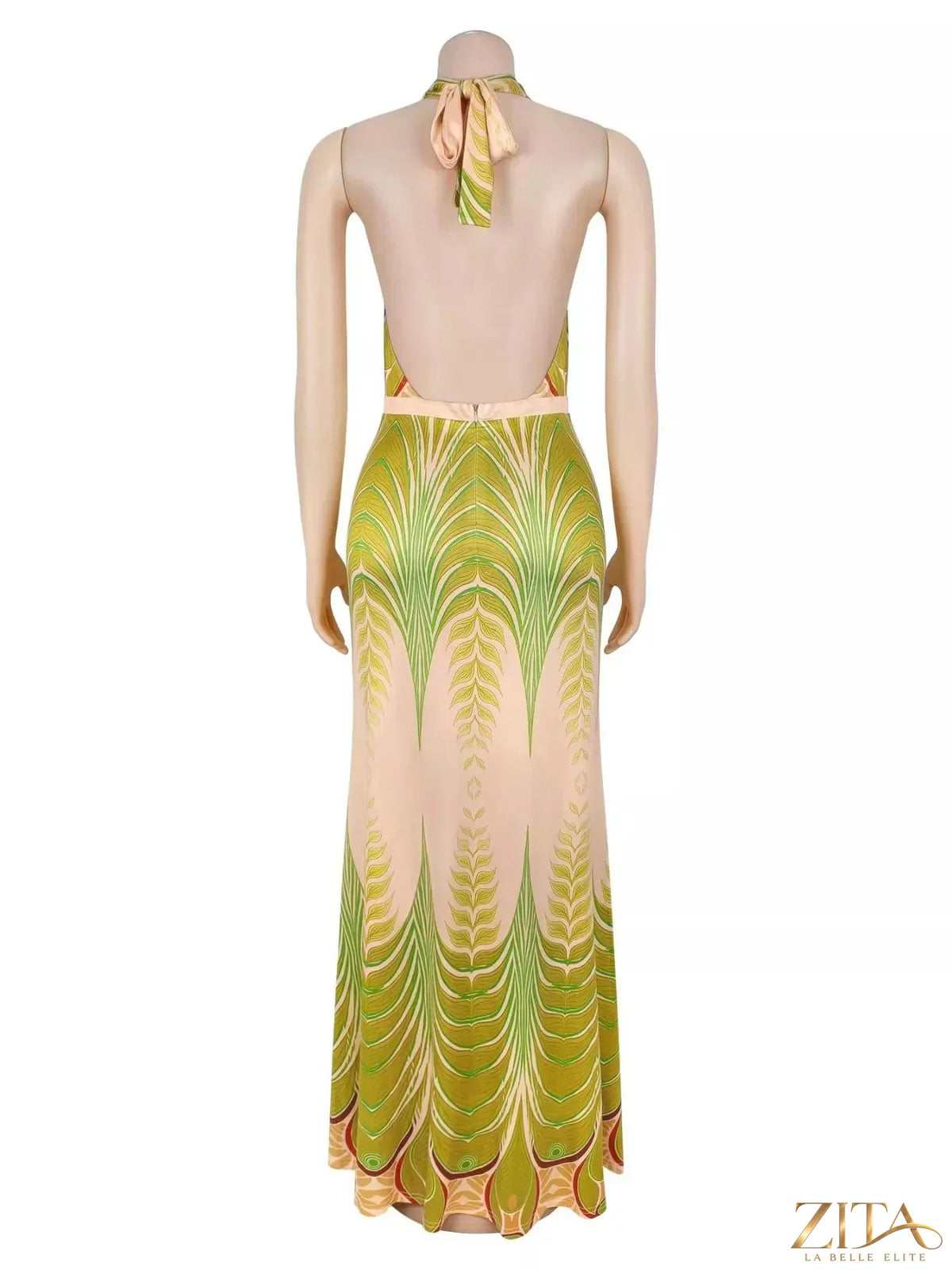 Elegant Zita La Belle Elite halter neck maxi dress with a gradient leaf print, flowing fabric, and stylish design.