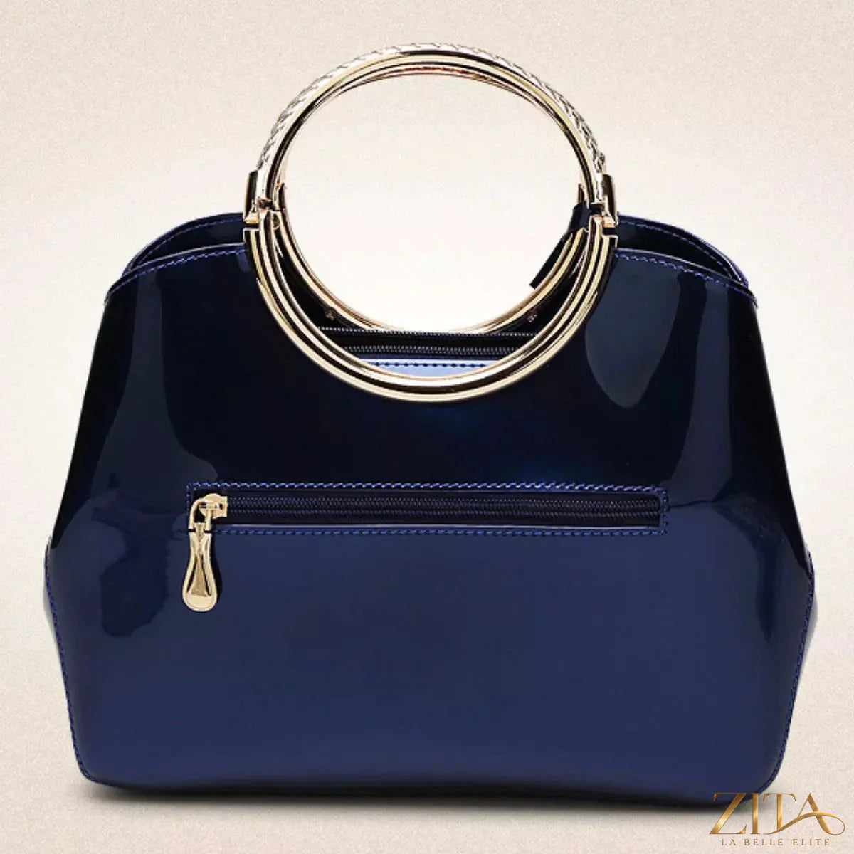 Glossy ring handle handbag by Zita La Belle Elite, featuring a sleek design with shiny finish and elegant handle detail.