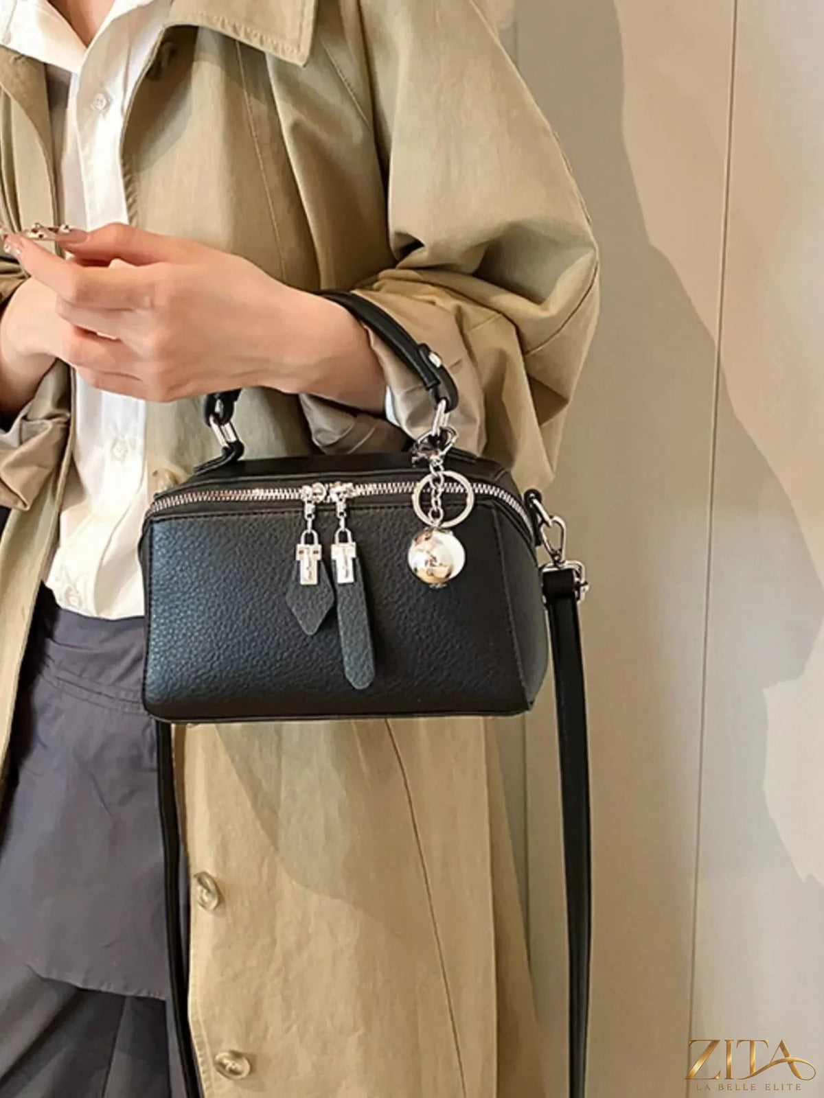 Textured leather handbag from Trendsi with sleek design and top handle, showcasing the detailed leather surface and elegant shape.