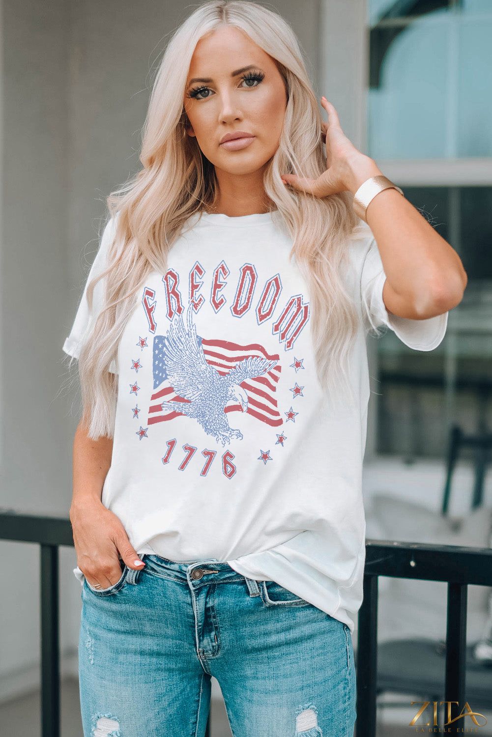 Black Freedom 1776 graphic T-shirt by Trendsi featuring patriotic design and bold text, casual fit ideal for everyday wear.