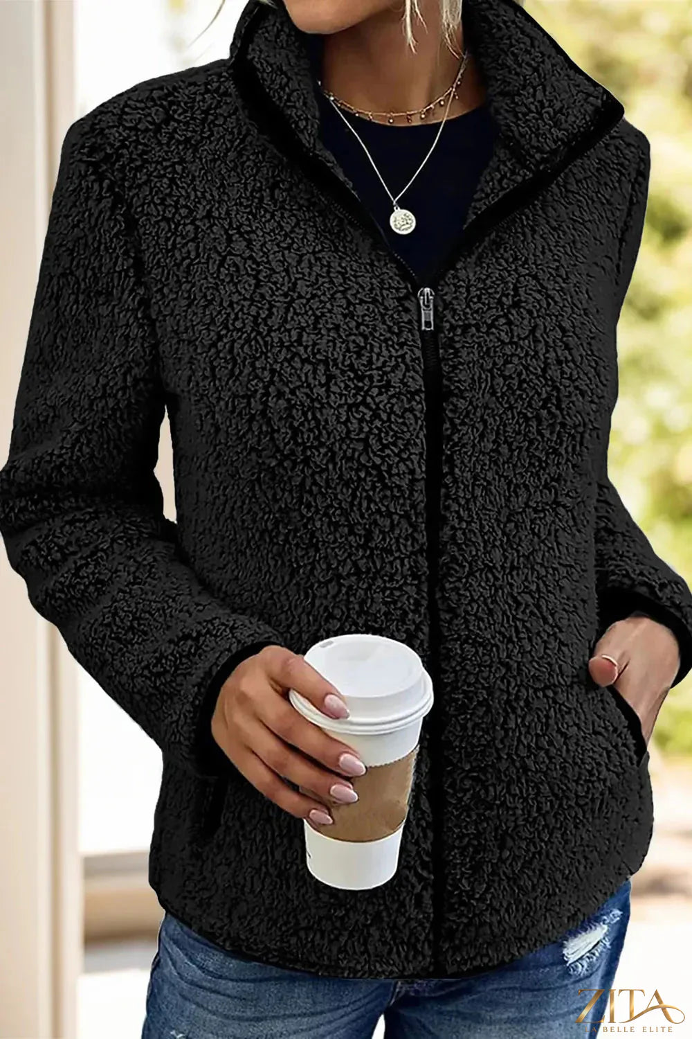 Trendsi Pocketed Zip Up Turtleneck Jacket in black, featuring a cozy turtleneck, front pockets, and a full zip closure.