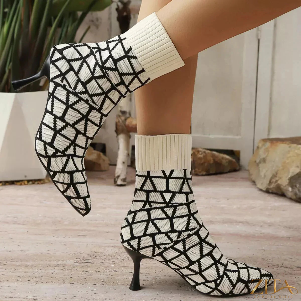 Zita La Belle Elite point toe flared heel boots in black leather, featuring a sleek silhouette and stylish high heel design.