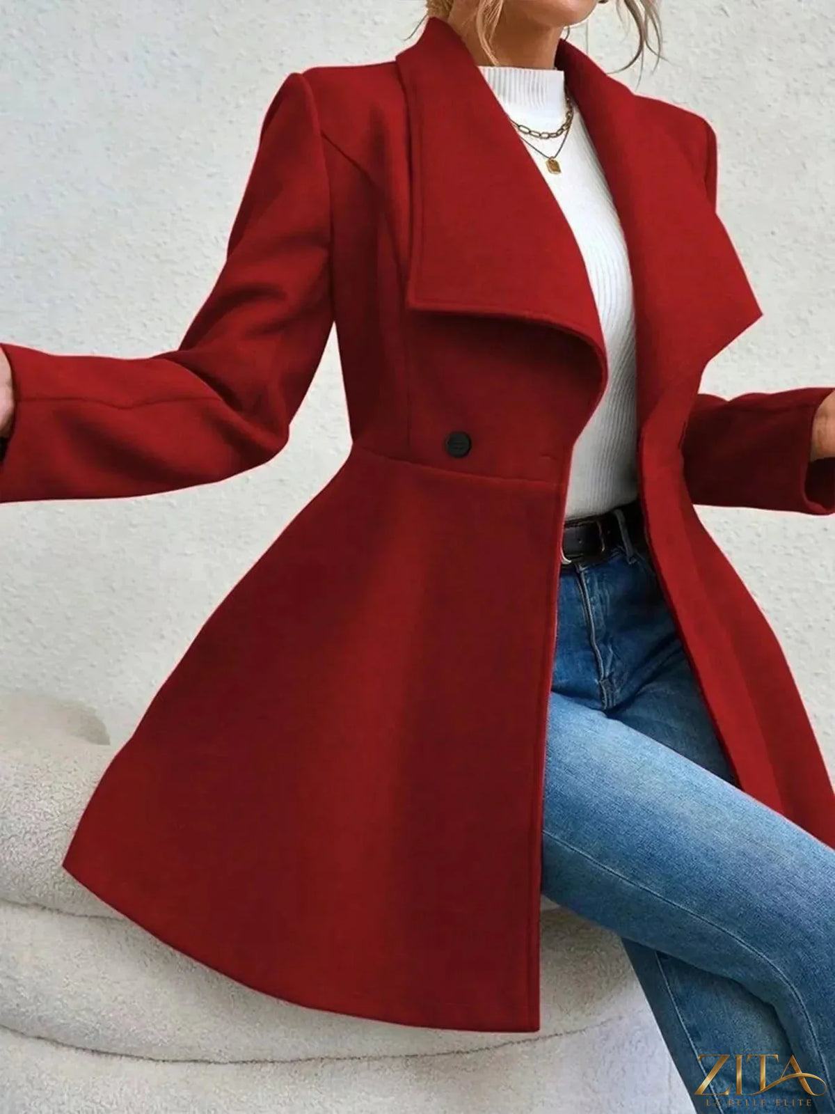 Zita La Belle Elite double-breasted wool blend coat hanging on a wooden rack with a tailored fit and classic design.