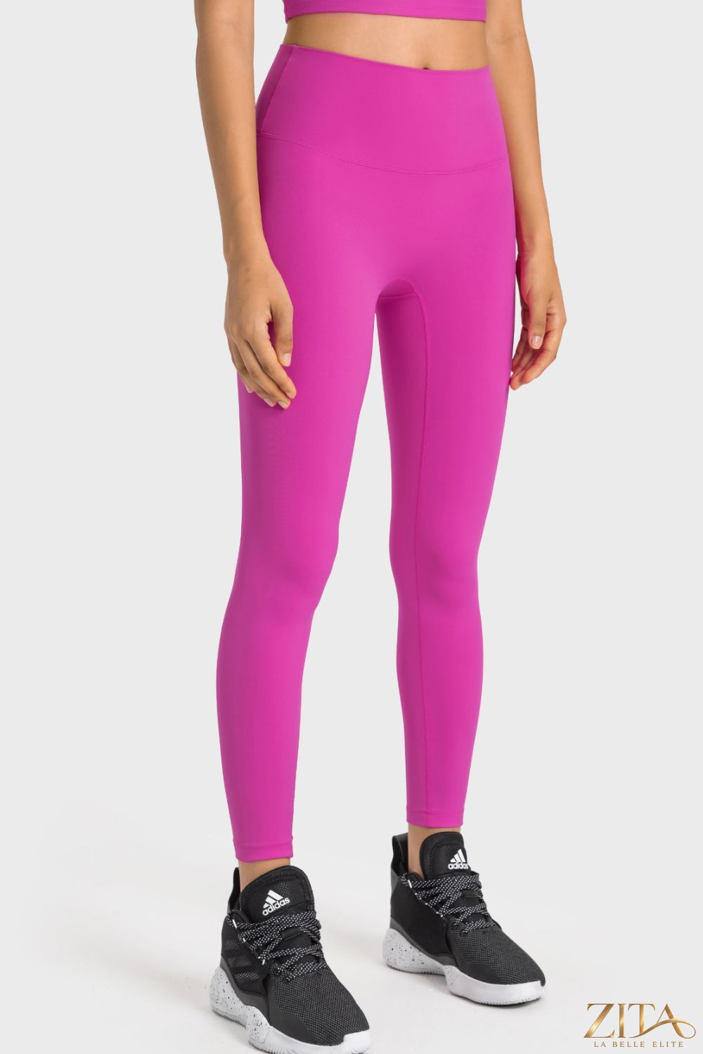 Millennia high-rise wide waistband yoga leggings by Trendsi, shown in black, featuring comfortable stretch fabric and a sleek fit.