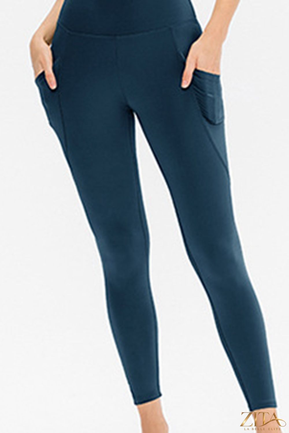 Slim fit long active leggings with pockets from Trendsi, featuring a sleek design and comfortable fit for active wear.