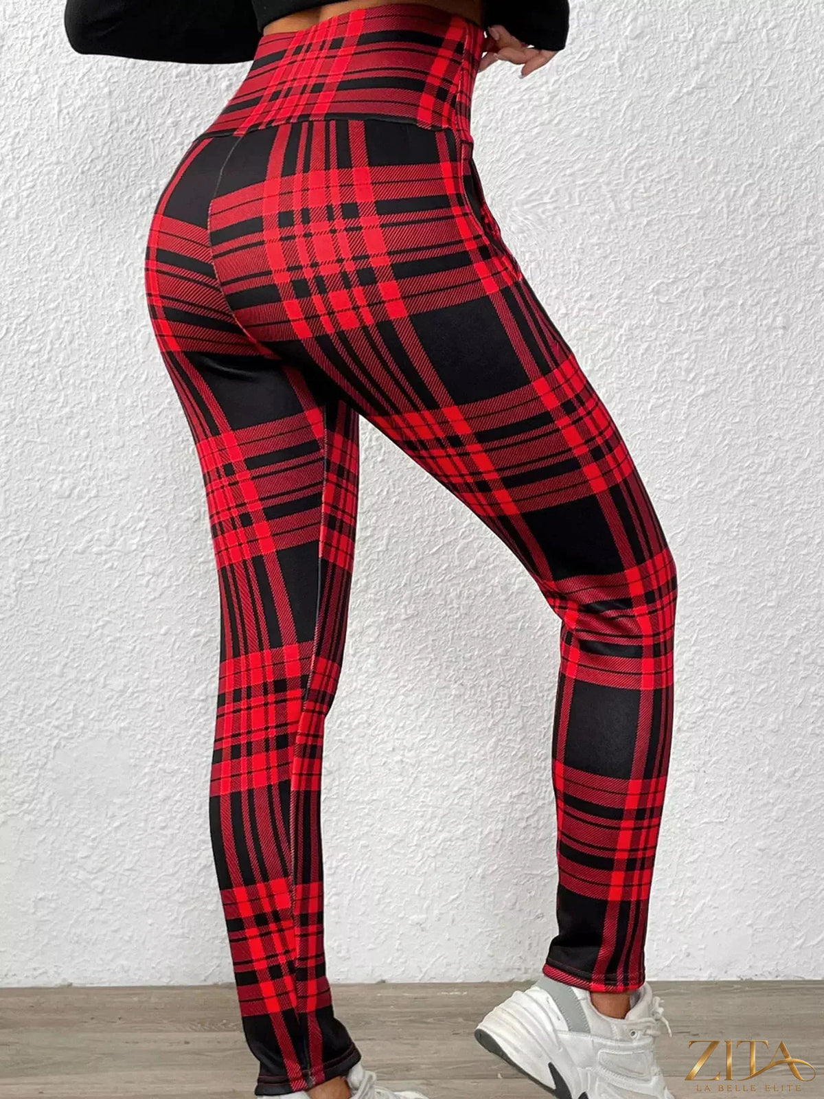 High-waisted plaid slim-fit leggings by Trendsi, featuring a stylish checkered pattern and snug fit for a trendy look.