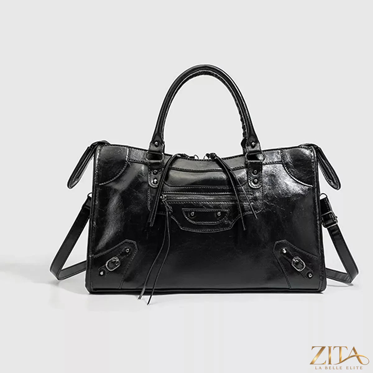 Zita La Belle Elite PU leather handbag with top handle, featuring a sleek design and sturdy strap, on a neutral background.