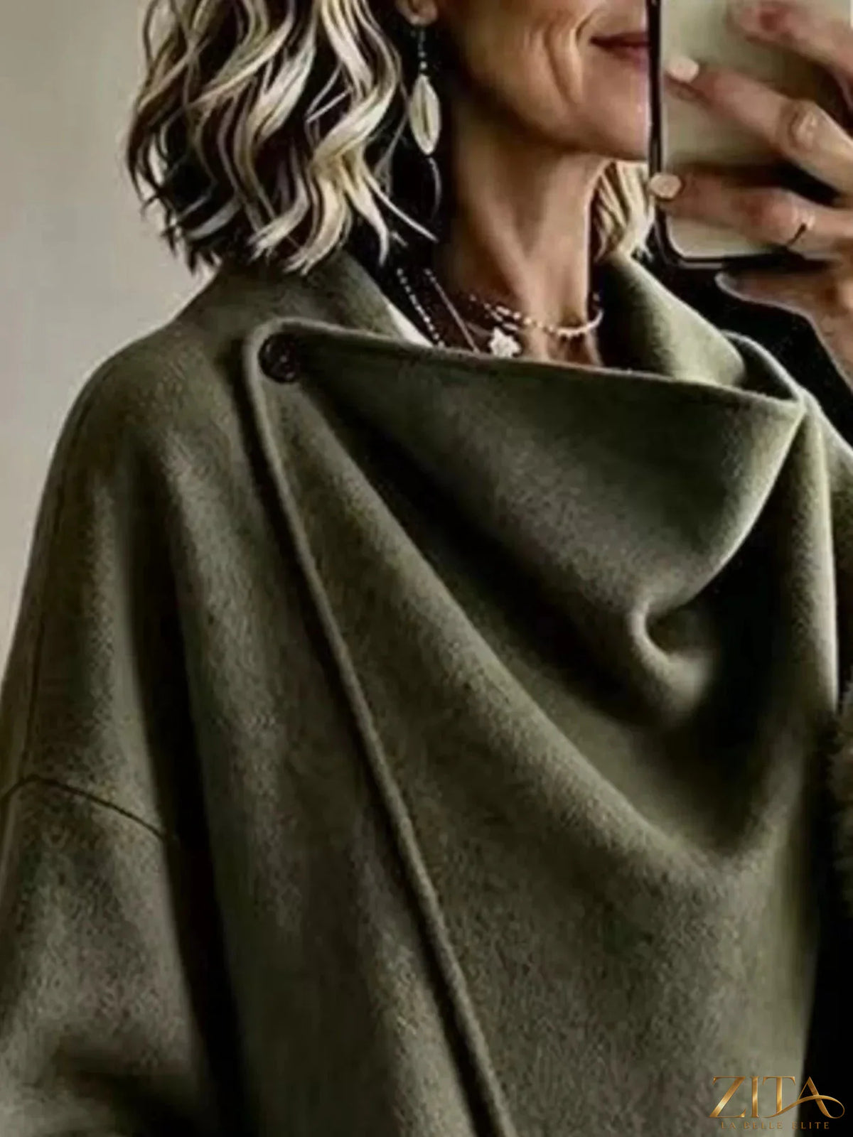 Plus size full-length outerwear by Zita La Belle Elite featuring asymmetric faux fur cuffs and elegant design.