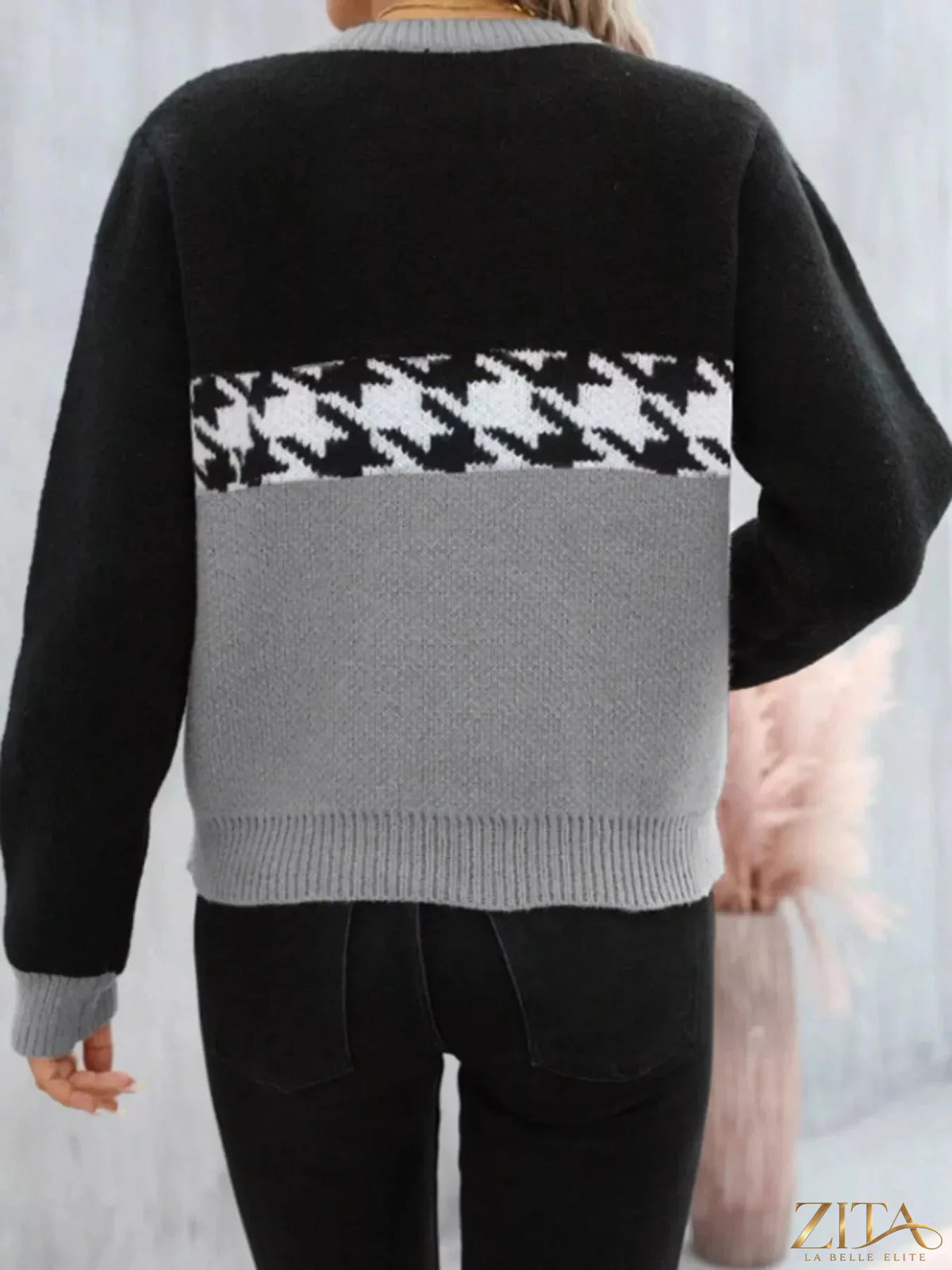 Color block houndstooth sweater by Trendsi featuring a stylish, multi-color pattern and cozy knit fabric for a fashionable look.