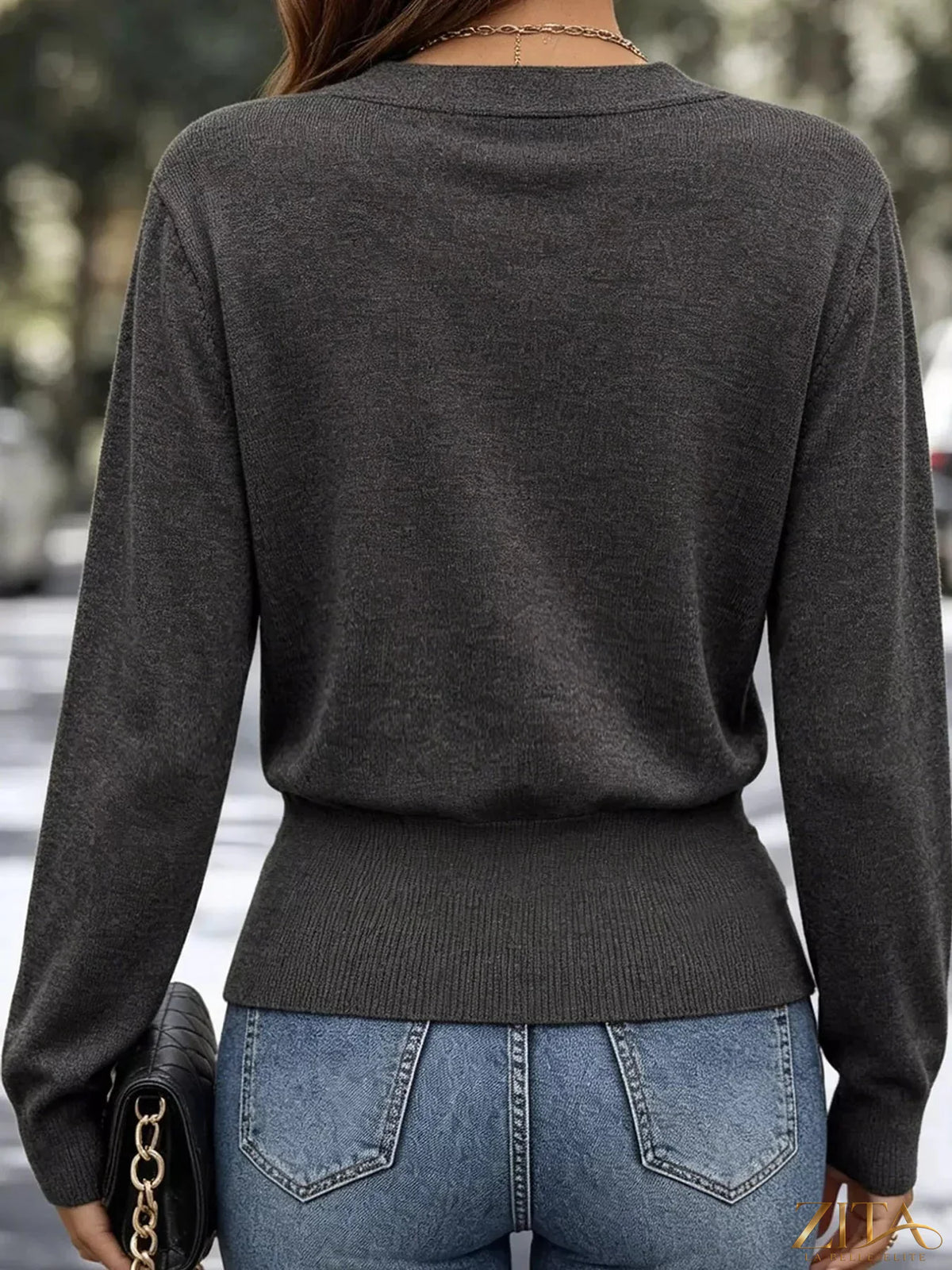 Zita La Belle Elite surplice long sleeve knit top with elastic waist, featuring a stylish and comfortable design in neutral fabric.