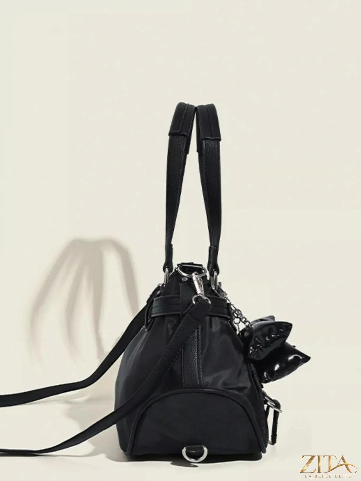 Leather handbag with buckle decor from Trendsi, featuring a sleek design and sturdy leather strap.