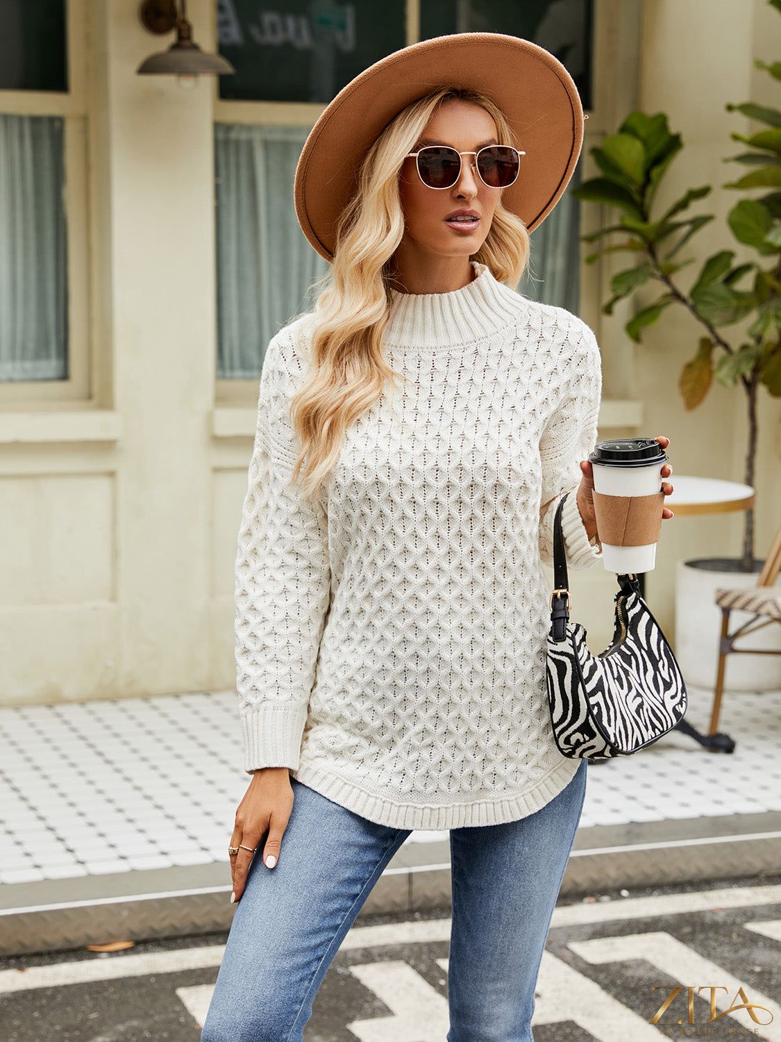 Zita La Belle Elite mock neck slit sweater in soft knit fabric, featuring a high neckline and side slits for a stylish look.