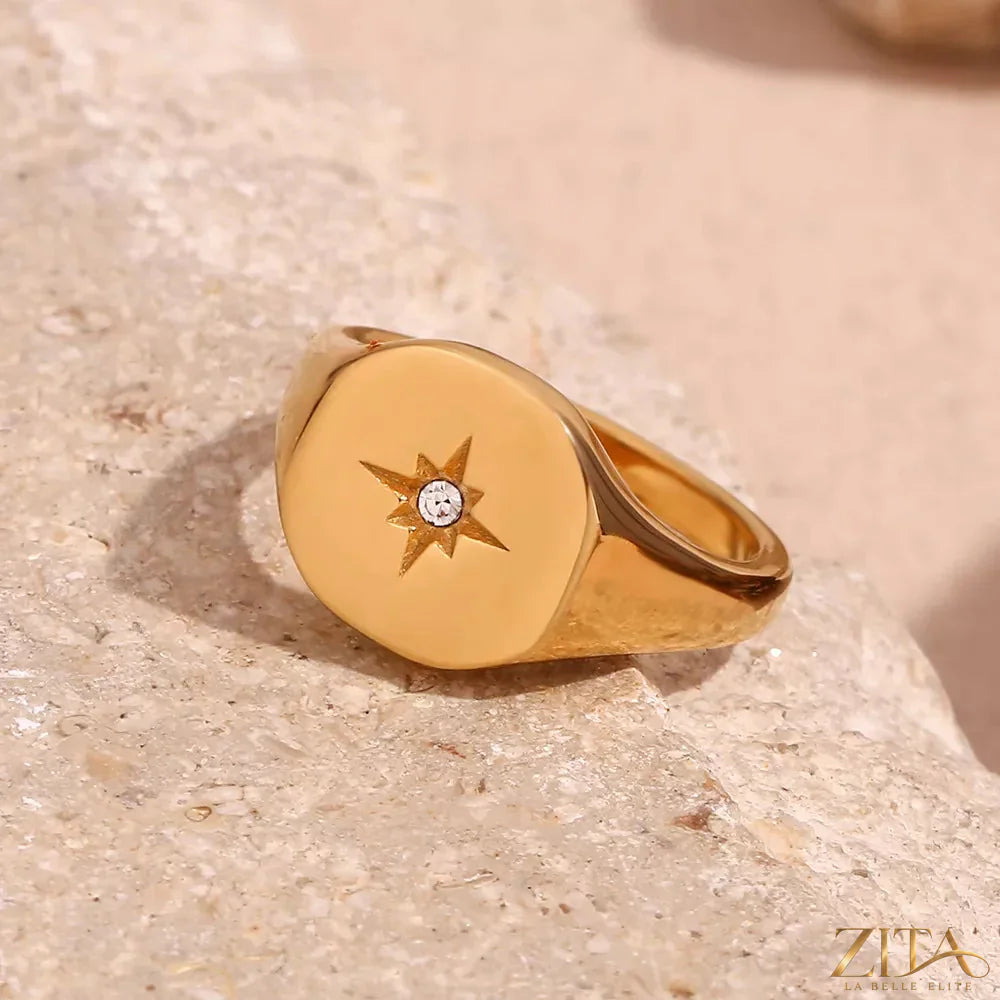 Minimalist North Star signet ring by Zita La Belle Elite, featuring a sleek design with a prominent star motif on polished metal.