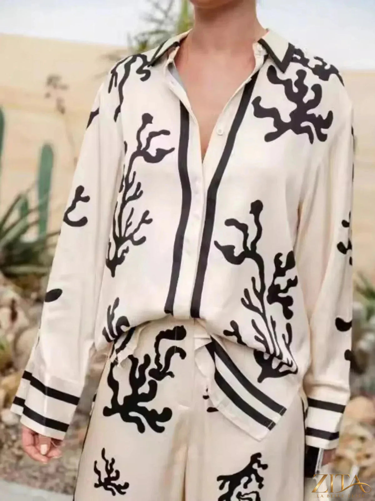 Printed long sleeve shirt and pants set by Zita La Belle Elite, featuring a stylish design and comfortable fit.