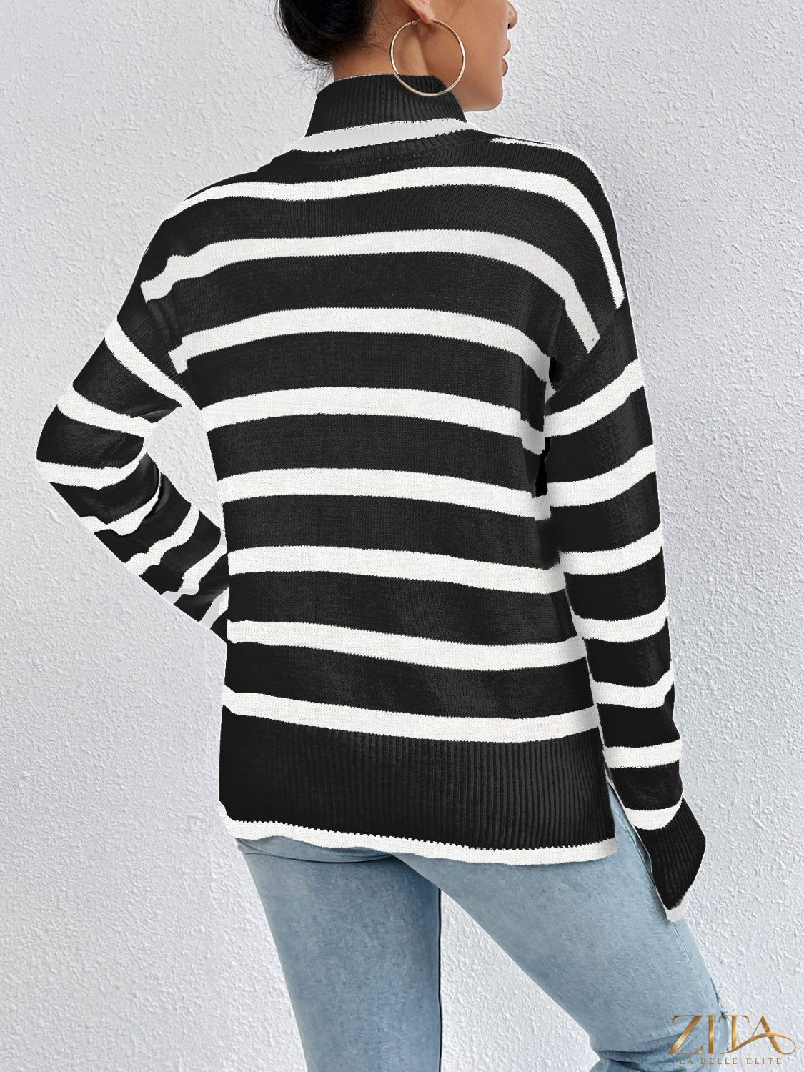 Striped turtleneck drop shoulder sweater by Trendsi, featuring a cozy knit with bold stripe pattern and relaxed fit.