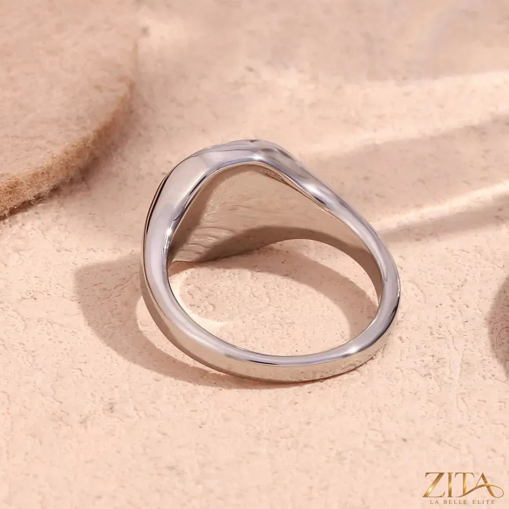 Minimalist North Star signet ring by Zita La Belle Elite, featuring a sleek design and star motif on polished silver band.