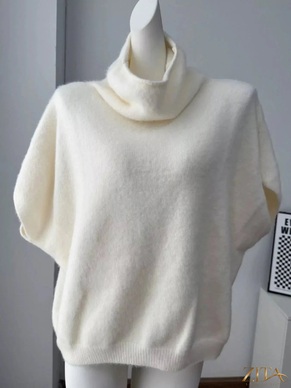 Zita La Belle Elite fuzzy short sleeve turtleneck sweater in cozy, textured fabric with a fitted silhouette.